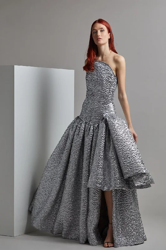 Strapless brocade gown with pleats and ruffles